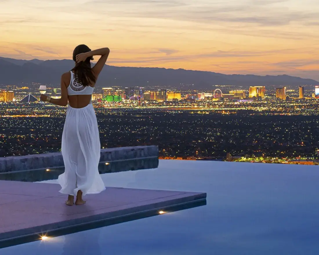 Girl by pool with view