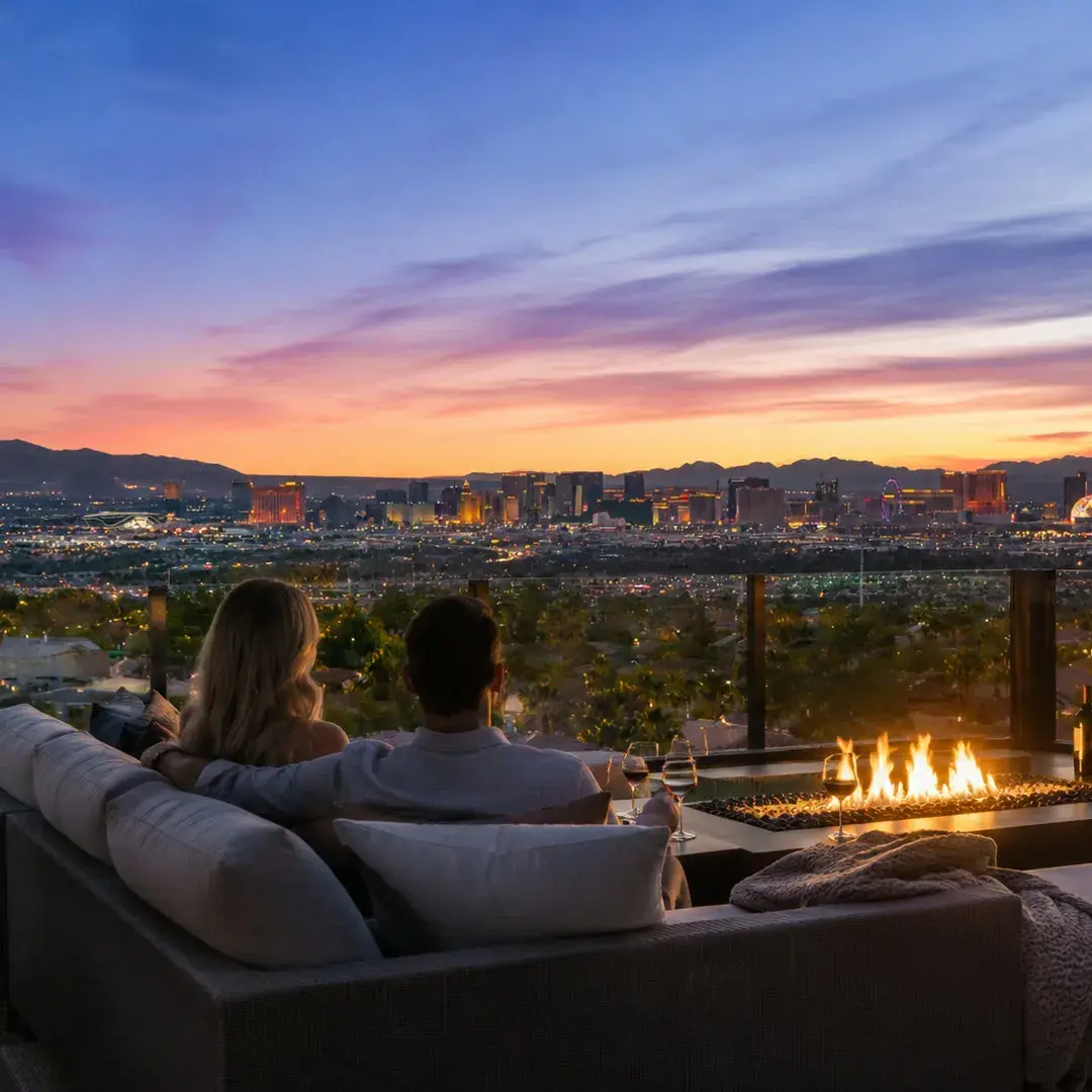 Couple by a fire pit on a view deck overlooking the Las Vegas Strip