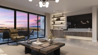 Residence 7 loft lounge with sliding glass doors to a deck overlooking the Las Vegas city lights at dusk