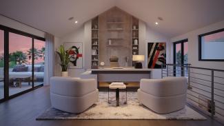 Vaulted home office with built-in shelving, a desk and two lounge chairs beside a covered deck